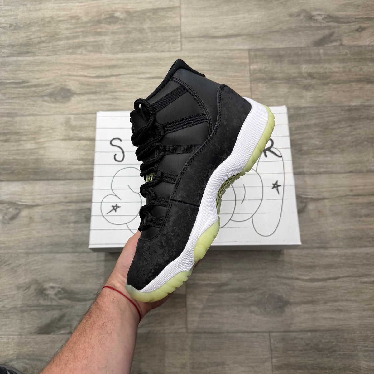 Jordan 11 Retro “Black Barely Volt”