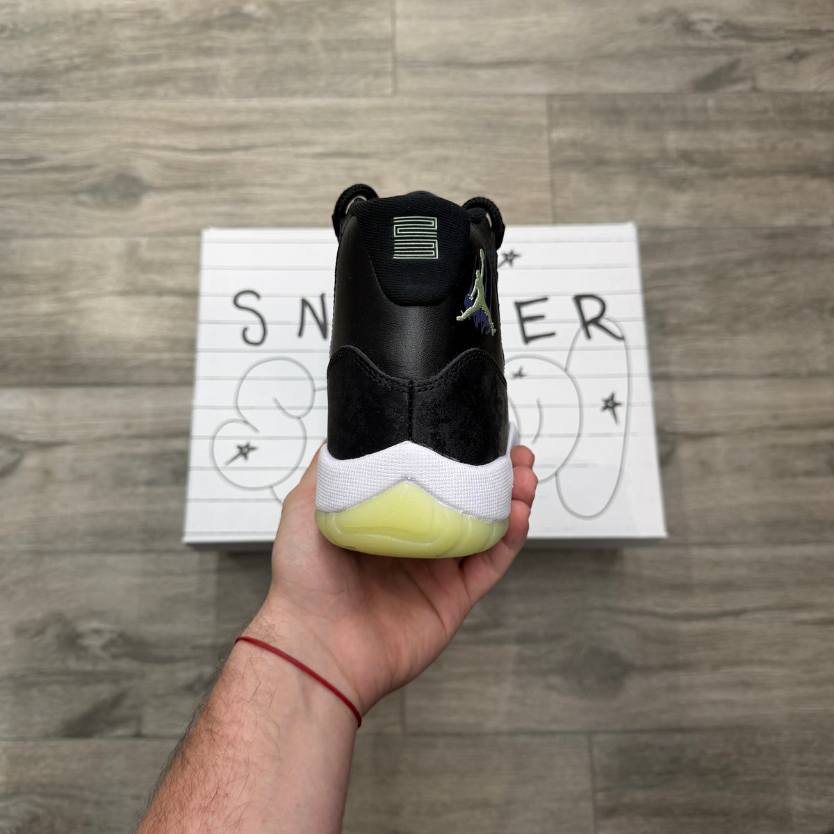 Jordan 11 Retro “Black Barely Volt”
